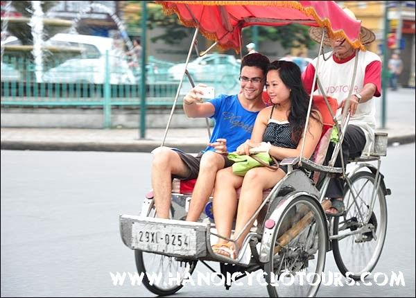 Couple on a cyclo tour, Hanoi